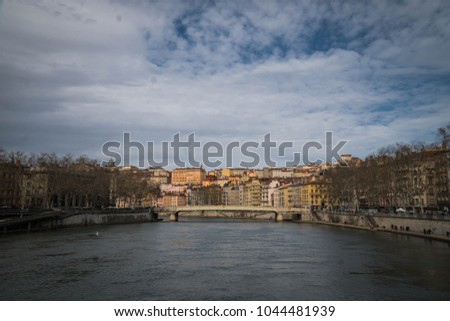 River of Saône in Lyon with old mediterranean houses shaping the skyline 