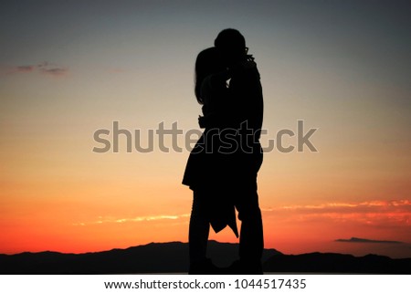 Silhouette of a couple loving each other