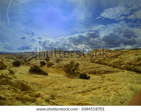 Sandstone landscape with blue sky.