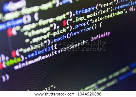 Mobile app building. IT specialist workplace. Mobile app developer. Javascript functions, variables, objects. JavaScript code in text editor. Abstract source code background. 