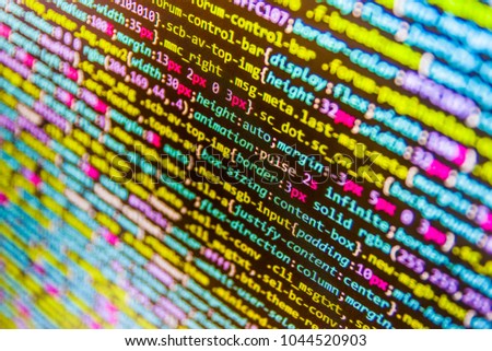 HTML5 in editor for website development. Big data and Internet of things trend. Script procedure creating. Website HTML Code on the Laptop Display Closeup Photo. Script procedure creating. 