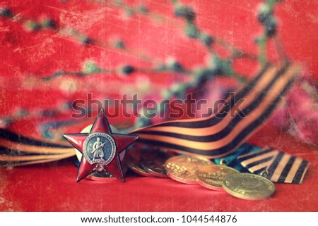 Awards of Merit in World War II by the Soviet Union on a vintage wooden background