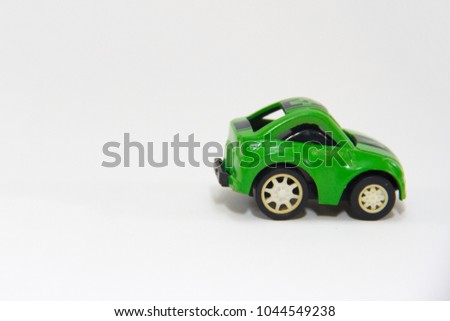 Green Mini Car plastic Toy isolated on white background.