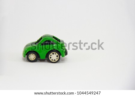 Green Mini Car plastic Toy isolated on white background.