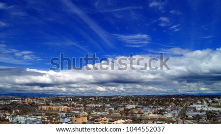 Stunning cloudscape and unique aerial perspective over Oceanside California in north county San Diego