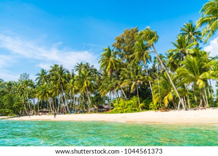 Beautiful tropical beach and sea with coconut palm tree in paradise island - Holiday Vacation concept
