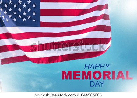Happy memorial day with american flag waving over blue sky background