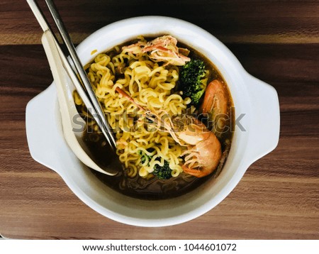 Korean noodles background / Noodles are a staple food in many cultures. They are made from unleavened dough which is stretched, extruded, or rolled flat and cut into one of a variety of shape