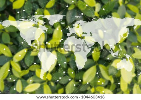 Global environment concept. The world map on blur green leave background. Element of this image furnished by NASA