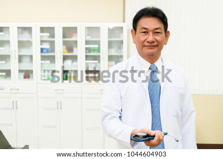 Doctor holding stethoscope, concept doctor, patient, medical on medical room background