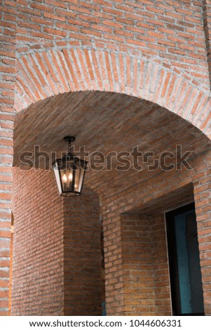 Vintage window of tunnel made by brick with lighting, stock photo