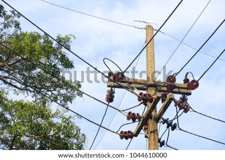 uprisen angle Large electric pole with wires