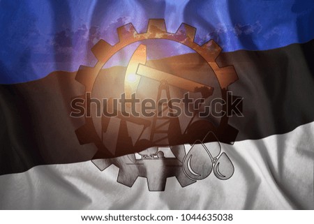 Oil rig against the background of the flag of Estonia. Mixed environment. The concept of oil production, minerals, development of new deposits, well.