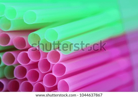 packing of multi-colored plastic tubes for cocktails and drinks