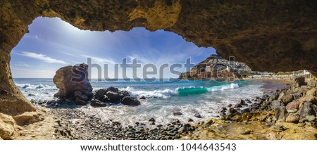 grotto on the beach on Playa del Cura, near playa Amadores ,Puerto Rico town, Gran Canaria, Canary Islands. Spain Royalty-Free Stock Photo #1044643543