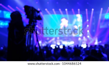 cameraman live streaming event production concert blurry defocus bokeh background