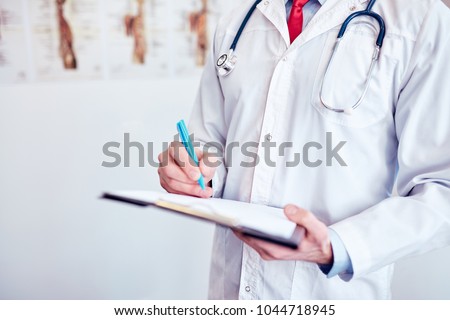 Close-up of a doctor in front of a bright background Royalty-Free Stock Photo #1044718945