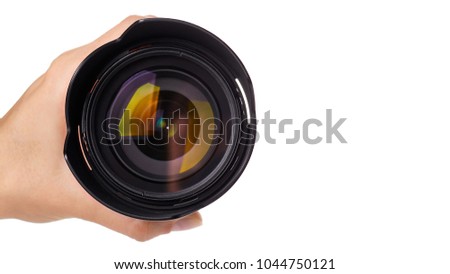 camera lens in hand isolated on white background. copy space, template.