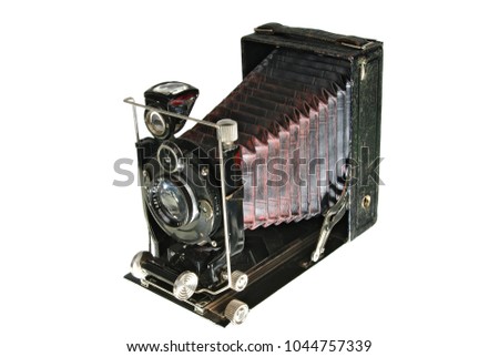 Retro old photografic camera. Isolated on white
