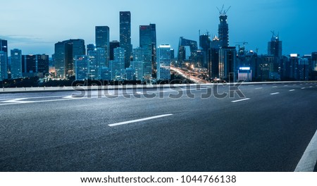 empty road with city skyline,beijing,china.