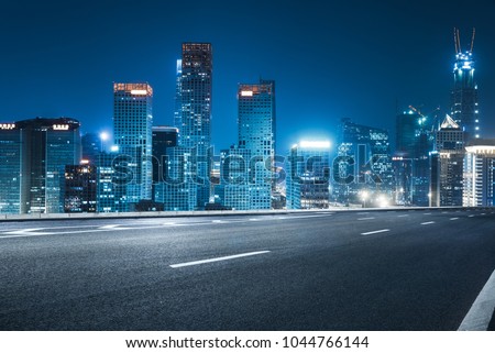 empty road with city skyline,shanghai,china.