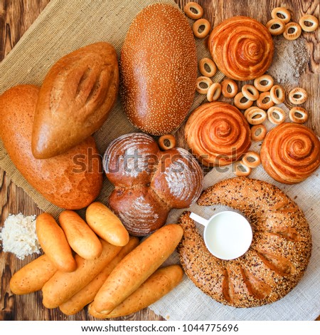Bread, composition with bread, cakes, pretzels, muffin, bun, cinnamon, pastries, scones, steamed bread