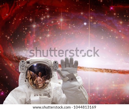 Astronaut flies in space. The elements of this image furnished by NASA.

