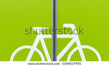 Detail of modern bicycle parking area in green color