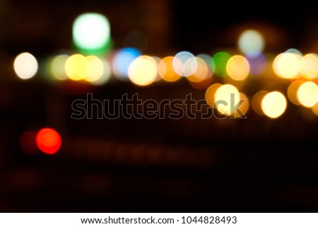 Bokeh effect from street lights and car at night