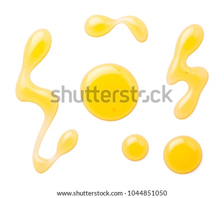 Honey isolated on white background. Top view Royalty-Free Stock Photo #1044851050
