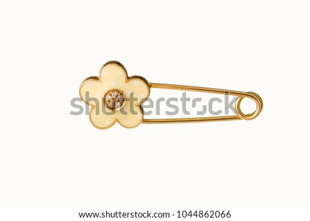 Beautiful Cute Baby & Kid safety Pin Brooch Jewelry with the safety pin design features a classic closure decorated throughout in yellow gold and diamond, birthday baby gift isolated on white 
