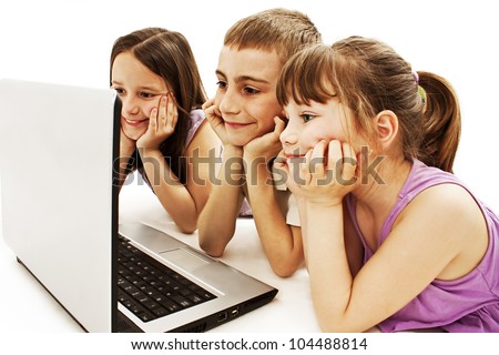 Happy kids with laptop computer. Isolated on white background.