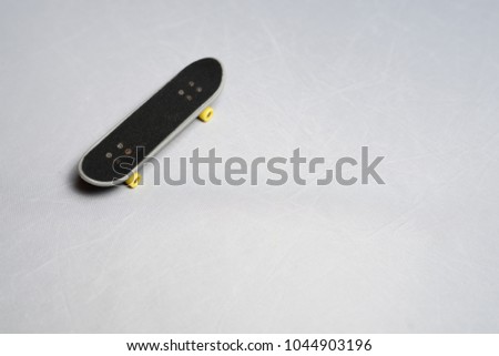 Finger mini skateboard toy on white background