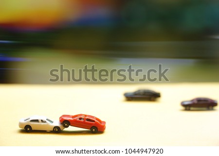 Car accident (Toy model, miniature) on street. Driver lost control. Lose time, Lose money. Insurance business concept. Copy space. 