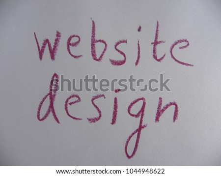 Text website design written by red oil pastel on white color paper