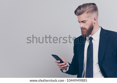 Leadership people contact links concept. Profile side view half-faced portrait of serious handsome clever managing busy official financier banker checking post getting sms isolated on gray background