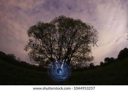 Series of pictures "Parallel reality".Photo on a long exposure with the light source , the light circle. Photos in style picture light

