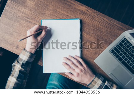 Paint painter sketch learn office workstation workplace letter notes feedback book idea report script classroom message home memo remark concept. Top view photo of left-handed man making notes in book Royalty-Free Stock Photo #1044953536
