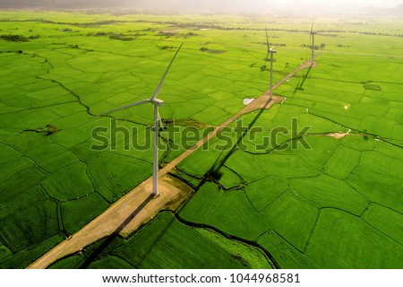 Landscape with Turbine Green Energy Electricity, Windmill for electric power production, Wind turbines generating electricity on rice field at Phan Rang, Ninh Thuan, Vietnam. Clean energy concept. Royalty-Free Stock Photo #1044968581