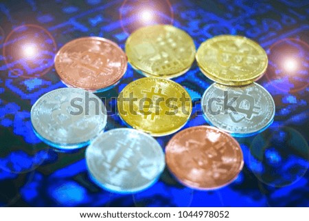 Bitcoin currency with a new concept symbol cryptocurrency and a blue digital background that is not focus.