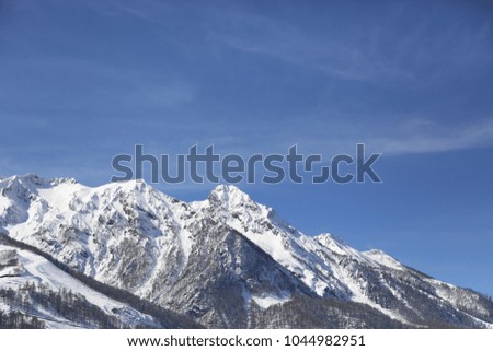 Gorgeous view on snowy mountains on a sunny day