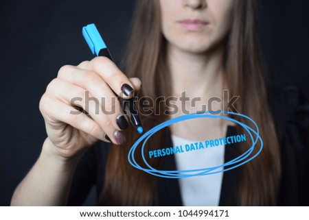 The businessman writes a blue marker inscription:PERSONAL DATA PROTECTION