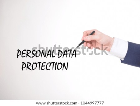 The businessman writes a black marker inscription:PERSONAL DATA PROTECTION
