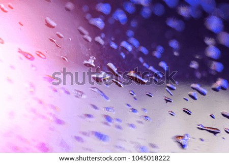 Abstract background of blue water drops light bokeh circles. Bright gold round defocused lights. Can use for poster, website, brochure, print.