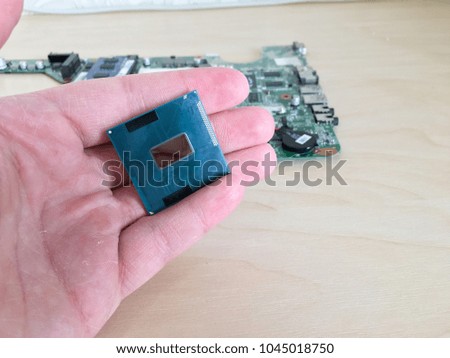 Close-up of a computer processor in hand