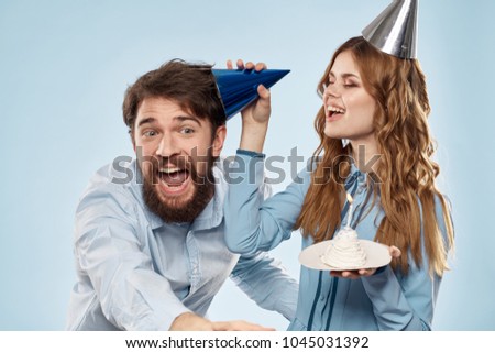holiday, woman and man in a cap, cake                             