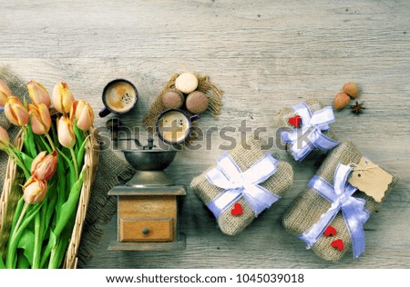 cup of coffee and flowers on a light wooden background /spring background  , party invitation design.