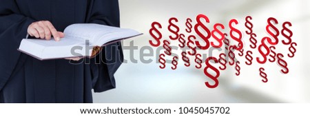 Digital composite of Judge holding law justice book with section symbol icons