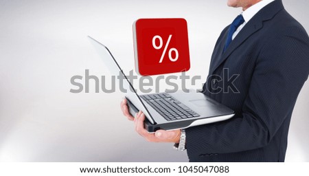 Digital composite of Hand holding laptop with percent symbol icons