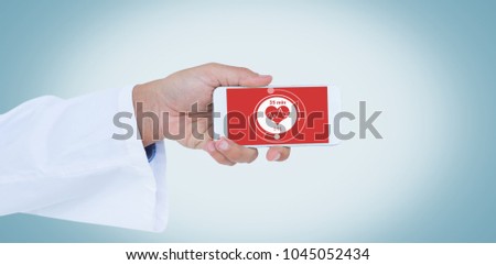 Male doctor holding smart phone with blank screen against digital composite of heart icon